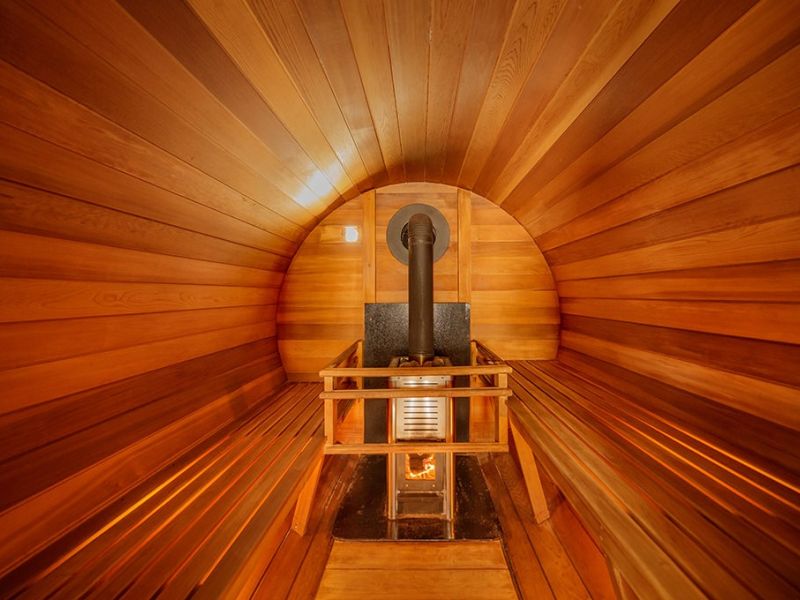Warm cedar sauna interior seen through the doorway
