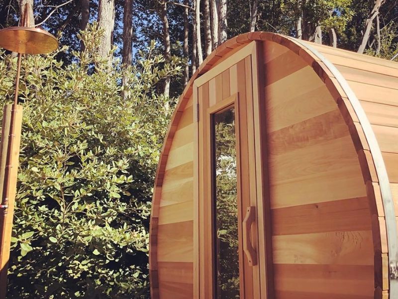 Sauna heater filled with rounded sauna rocks ready to produce steam